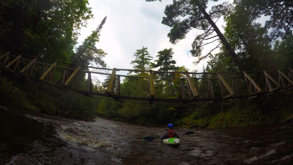 a menacing bridge crossing the Brule river